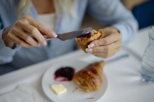 File:Breakfast at a cafe with croissant and jam in the morning.jpg